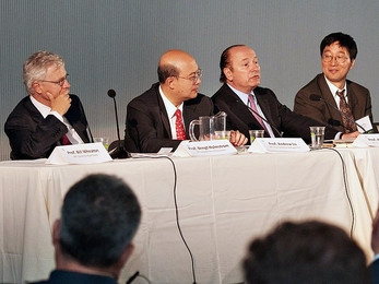 At the 25th-anniversary conference of MIT’s Center for Real Estate, members of a panel on “Financial Re-Engineering” included (from left): Bengt Holmstrom, the Paul A. Samuelson Professor of Economics; Andrew Lo, director of the Laboratory for Financial Engineering at the MIT Sloan School of Management; Robert C. Merton, School of Management Distinguished Professor of Finance; and Jiang Wang...