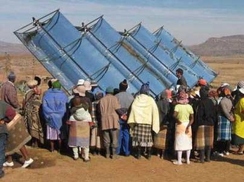 Villagers in Ha Teboho, in the southern African nation of Lesotho, gather to learn about a new concentrating solar generator and hot water system installed by MIT students.