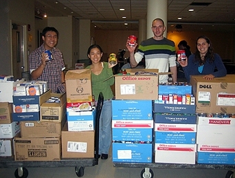 It took several volunteers — including, from left, George Lan, Chelsea He, Tim Curran, Amy Bilton — to weigh, sort, and pack the 1,496 pounds of collected items, which were delivered to the Greater Boston Food Bank.