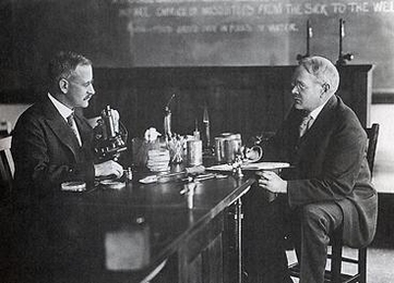 In this photo taken in the 1920s, Samuel Cate Prescott, left, and William Lyman Underwood discuss their canning research.