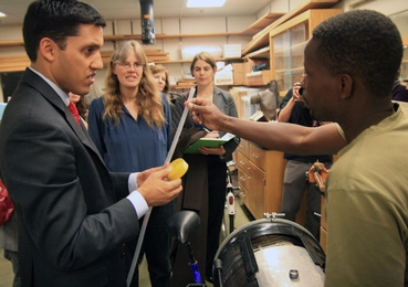 Dr. Rajiv Shah, head of USAID, visits with D-Lab Founder Amy Smith, center, and students in D-Lab.