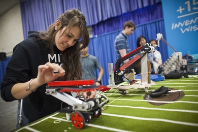 Sophomore Paulina Mustafa demonstrates her robotic at the MIT open house on April 30.