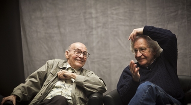 Marvin Minsky, left, and Noam Chomsky chatted as they waited for the symposium’s kickoff panel, 'The Golden Age,' to begin.