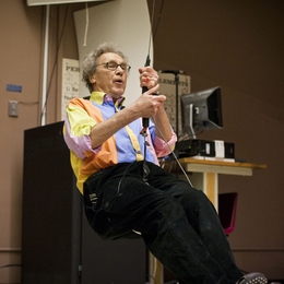 Walter Lewin demonstrates one of his famous lectures, showing that a pendulum’s period remains constant regardless of mass.