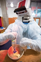 The PR2 mixes butter, one of several steps necessary for the robot to bake chocolate chip cookies.