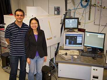 Research Laboratory of Electronics graduate students Vitor Manfrinato and Lin Lee Cheong, with the electron-beam lithography system they used in their experiments.