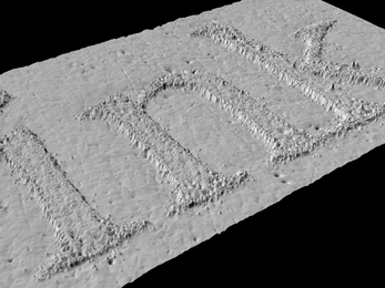 Not only do the images produced by GelSight, a new, portable imaging system from researchers in the Department of Brain and Cognitive Sciences, have a resolution that previously required expensive laboratory equipment, but they're 3-D, too. Here, GelSight images particles of ink spelling the word 'ink' on a piece of paper.