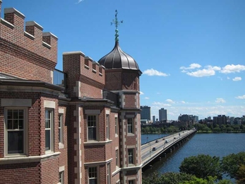 Fariborz Maseeh Hall, originally erected as the Riverbank Hotel, overlooks the Charles River and the Boston skyline.