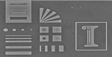 A glass stamp reproduces precise, nanometer-scale etchings in silver. The original engraving, pictured above, is 10 microns wide — less than a quarter of the diameter of a human hair.