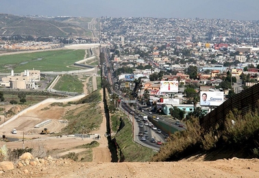 A small fence separates densely populated Tijuana, Mexico, right, from the United States in the Border Patrol's San Diego Sector.