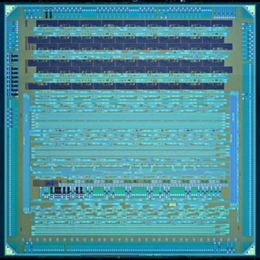 A new test chip developed by Vladimir Stojanovic, Rajeev Ram and their colleagues, which monolithically integrates electrical and optical components and was produced on an existing IBM manufacturing line.