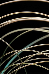 A new fiber developed by Yoel Fink's group emits blue laser light only at a precisely controlled location.