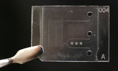 The Center for Polymer Microfabrication is designing processes for manufacturing microfluidic chips. Pictured here is a chip fabricated by the center's tailor-made production machines.