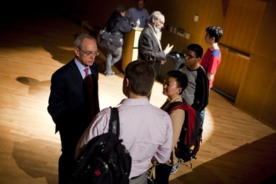 Provost L. Rafael Reif, left, and Chancellor Eric Grimson discuss <i>MITx</i> with MIT students in Simmons Hall on Wednesday evening.