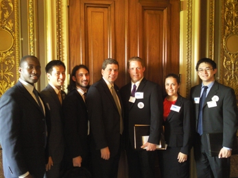 From left, Richard Agbeyibor, Patrick Wen, Daniel Rothenberg, U.S. Sen. Mark Begich (D-Alaska), Dillon Gardner, Eleanor Bors and Michael Chang.