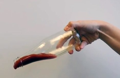 Ketchup slides out of a bottle that has the food-based, nontoxic LiquiGlide coating on the inside.