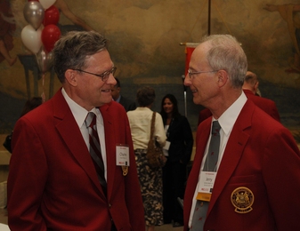 Charles Phillips '61 and Jerry Saltzer '61, SM '63, ScD '66 — fully decked out in red jackets and insignia — enjoy a 50th reunion gathering last year.