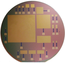 This silicon wafer consists of glucose fuel cells of varying sizes; the largest is 64 by 64 mm.