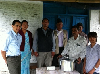 Greg Tao &#39;10, SM &#39;12 (left), delivers an autoclave prototype to a rural Nepali health clinic in January 2012.