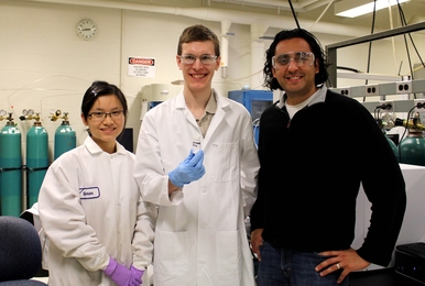 Paper authors (l-r) Yuran Wang, William Gunther and Yuriy Roman show a sample of the inorganic catalyst Sn-Beta zeolites with borate salts