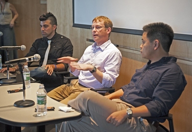 Team members, from left, Bobak Ferdowsi SM '03, Steve Sell and Allen Chen '00, SM '02 relive the landing of the Mars Curiosity rover.