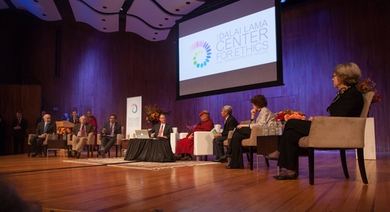 Scholars discussed environmental challenges on Monday at MIT with the Dalai Lama. From left: John Sterman and Kerry Emanuel of MIT; M. Sanjayan, moderator, of The Nature Conservancy and the University of Montana; Thomas Malone of MIT; the Dalai Lama; a translator; Rebecca Henderson of Harvard; and Penny Chisholm of MIT.
