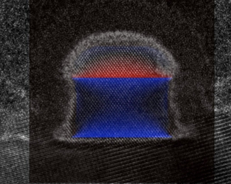 In this micrograph of an experimental transistor, blue highlighting indicates areas of "strain," where germanium atoms have been forced closer together than they find comfortable. One of the reasons for the transistor's record-setting performance is that the strain has been relaxed in the lateral direction.