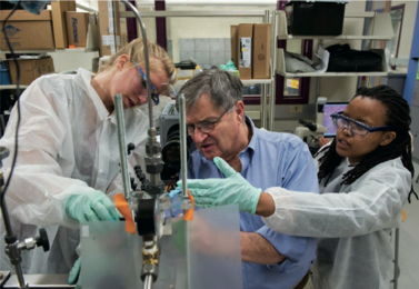 In their class project, Tshiamo Lechina ’13 (right) and Melissa Showers ’13 worked with Professor of Chemical Engineering Clark Colton to develop flow visualization techniques that will permit analysis of fluid dynamics in a process to create new materials for more energy-efficient tires.