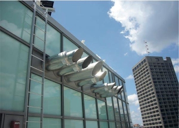 Performing the blower door test on the new Sloan building required first sealing up all external openings, including the kitchen fans shown here.