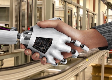 a robot hand and a human hand, shaking