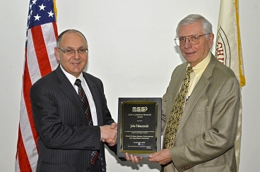 Gerald Augeri (left), assistant head of the Air and Missile Defense Technology Division at MIT Lincoln Laboratory and chairperson the 2012 Military Sensing Symposium, presented John Tabaczynski with the 2012 Jamieson Award.