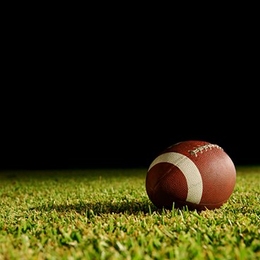 Football on grass field 