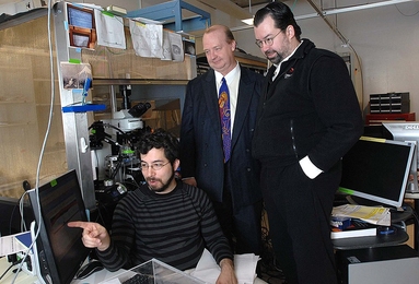 Ed Boyden, seated, and Joost Bonsen, right, co-teach the class "Neurotechnology Ventures." Rutledge Ellis-Behnke, center, also co-taught the class during its first few years.