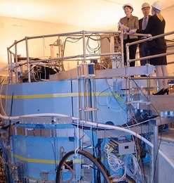 U.S. Senator Jeanne Shaheen, Alcator C-Mod Head Earl Marmar and Nuclear Engineering Assistant Professor Anne White view the Alcator C-Mod Project from atop the tokamak.