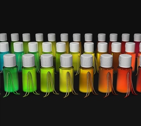 Vials containing colloidal semiconductor quantum dot nanocrystals (NCs) emit colors that are determined by the exact size of the particles. In this image, curves in front of each vial show the measurements made by the MIT team: The outer, wider curve shows the spectrum of colors from all the NCs in that vial, while the narrower curve shows the average single-particle spectrum within that vial. Unt...