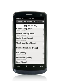 Mobile phone displaying song playlist