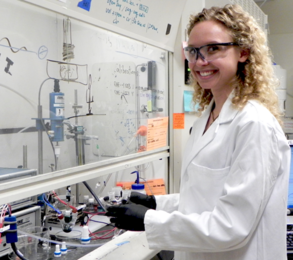 Kelsey Stoerzinger at hood where she conducts experiments on electrolytic catalysts in water-based solutions. 