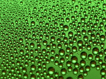 On typical hydrophobic coatings, droplets forming from high-temperature steam soon spread out to coat the surface, quickly degrading their performance. The new coating, seen here, maintains its ability to foster droplet formation over long periods.
