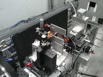 The team&#39;s small prototype neutron microscope is shown set up for initial testing at Oak Ridge National Laboratory. The microscope mirrors are inside the small metal box at top right.