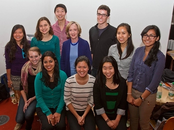 SuperUROP students gather with Susan Hockfield for a group photo. From left (seated): Christy Swartz, Harshini Jayarama, Qui Nguyen, and Michelle Chen; (standing): Angela Zhang, Chelsea Finn, Susan Hockfield, Jennifer Liu and Anvisha Pai; (back row): Francis Chen and Benoit Landry.