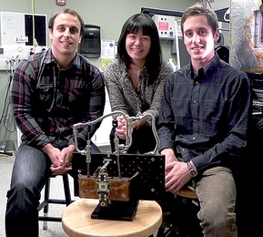 Associate Professor of Mechanical Engineering Evelyn Wang (center), post-doctoral associate Nenad Miljkovic (left) and graduate student Andrej Lenert (right) pose with the solar thermal photovoltaic experimental system.