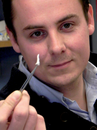 Thomas Crouzier, a postdoc associate at MIT's Laboratory for Biological Hydrogels, holds a sample of a gel reconstituted from mucins (key components of mucus). MIT's Laboratory for Biological Hydrogels studies mucins to learn how mucus functions and how to promote its recovery when it fails.