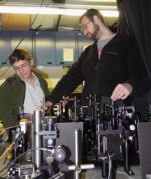 Alexei A. Maznev (left) and Jeffrey K. Eliason with time-resolved optical spectroscopy used to demonstrate ballistic acoustic phonon transport in silicon.  