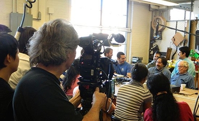 50 Eggs Films cinematographer Donald McIntosh films the conversation.