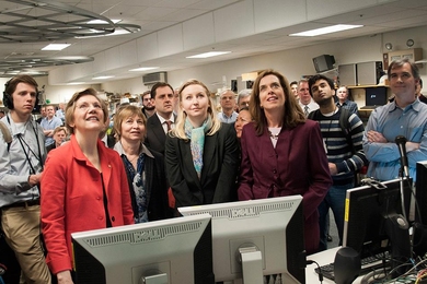 Listening to the countdown and watching a screen of the tokamak's interior, (from left) Warren, MIT Vice President for Research Maria Zuber, Livingstone (back), nuclear science and engineering assistant professor Anne White, Clark, and research scientist Jerry Hughes (far right), along with press and staff, await the the &#39;shot&#39; that will create the plasma in Alcator C-Mod.