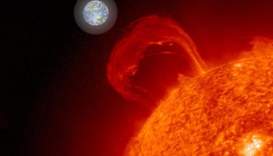 Photo illustration of the sun with a giant loop of gas (a sun flare) coming off of it