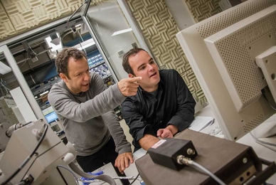 Visiting artist Vik Muniz (left) and MIT alum Marcelo Coelho at MIT's Center for Bits and Atoms. 