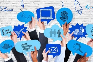 Photo illustration of hands in business attire holding thought bubbles with various icons