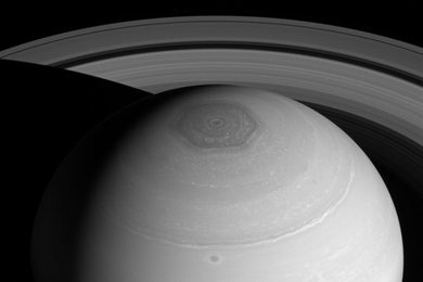 Saturn's north polar vortex and rings.