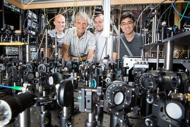 Grad student Colin Kenned, Professor Wolfgang Ketterle, grad student William Cody Burton, and grad student Woo Chang Chung. The Ketterle group is working with lasers to create superfluids.